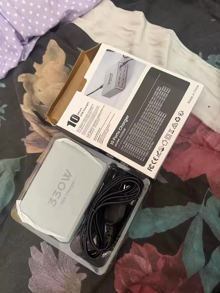 PowerNorth charger in its opened box with the included power cable