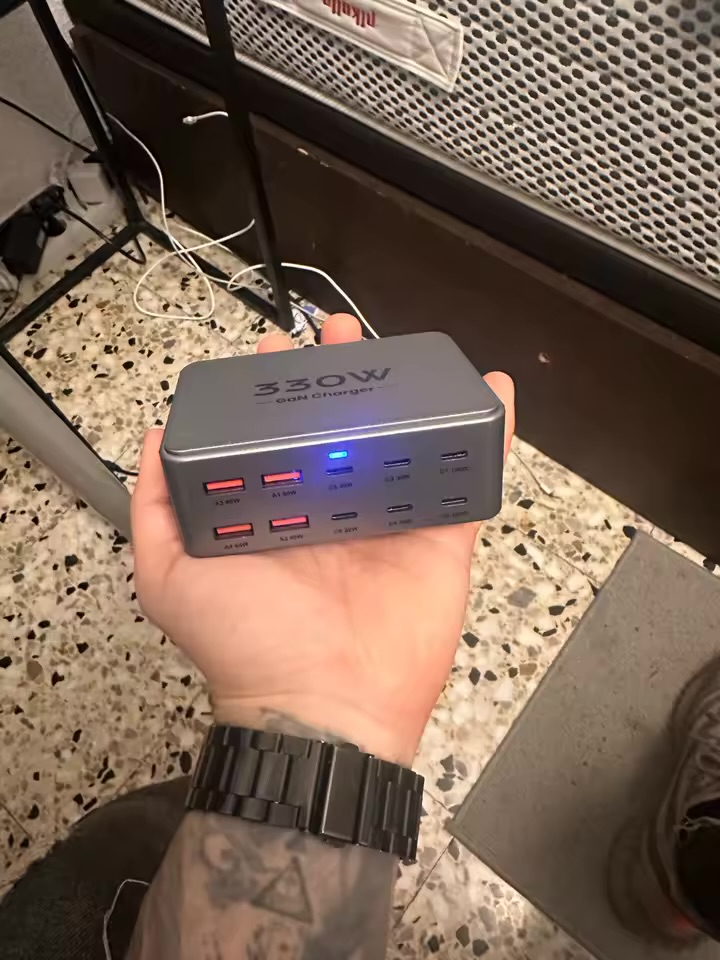 PowerNorth charging station held in hand in a workshop
